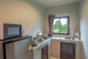 Kuchyň nebo kuchyňský kout v ubytování Malinee Resort
