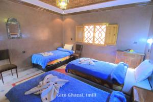 Uma cama ou camas num quarto em Chez Ghazal Imlil
