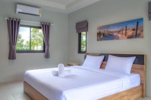 Postel nebo postele na pokoji v ubytování Malinee Resort + 37 fotografií