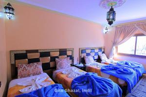 Uma cama ou camas num quarto em Chez Ghazal Imlil