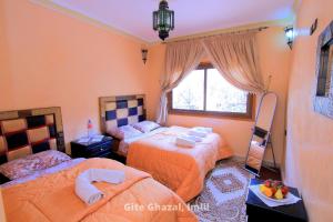Uma cama ou camas num quarto em Chez Ghazal Imlil