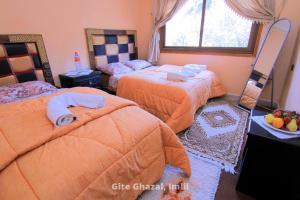 Uma cama ou camas num quarto em Chez Ghazal Imlil