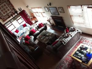 an aerial view of a living room with couches at Happy Jackal Guest House in Colchester