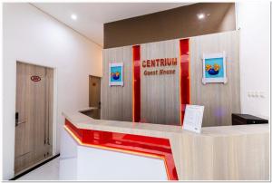 a lobby with a cash counter with a great house sign at RedDoorz Plus @ Centrium Katamso Medan in Medan
