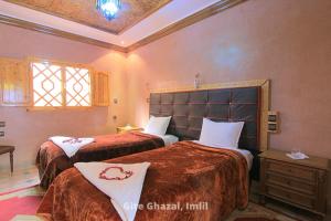 Uma cama ou camas num quarto em Chez Ghazal Imlil