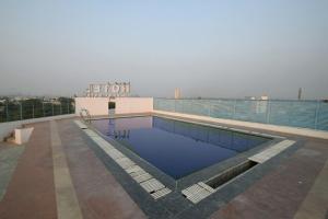 a swimming pool on the roof of a building at Hotel Sky Inn in Jaipur