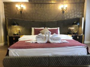 מיטה או מיטות בחדר ב-Burj Al Istanbul
