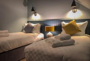 a hotel room with a bed and two lamps at The Balavoulin in Aviemore