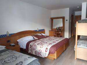 Postel nebo postele na pokoji v ubytování Hotel Panorama