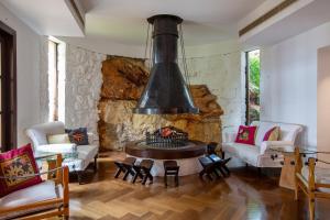 a living room filled with furniture and a fire place at The Marmara Bodrum - Adult Only in Bodrum City