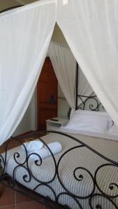 Ein Bett oder Betten in einem Zimmer der Unterkunft Villa Blanco's