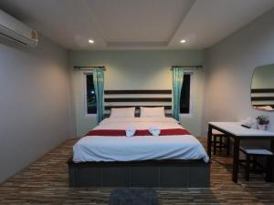 Postel nebo postele na pokoji v ubytování Janrawee Resort