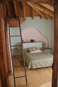 Un pat sau paturi într-o cameră la El Canto del Gallo