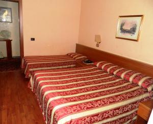 Postel nebo postele na pokoji v ubytování Buonarroti Home