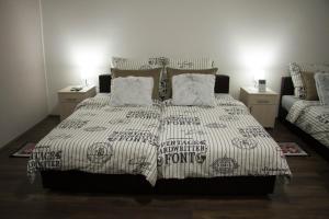 a bedroom with a bed and a couch at Alex Lodge in Zrenjanin