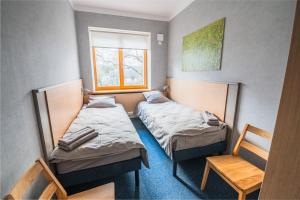 Un pat sau paturi într-o cameră la Hostel Sili
