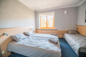 Postel nebo postele na pokoji v ubytování Hostel Sili