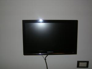 TV a/nebo společenská místnost v ubytování Albergo Moretti