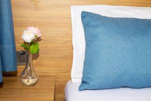 A bed or beds in a room at Marina Hotel Bodrum