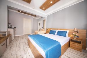 A bed or beds in a room at Marina Hotel Bodrum