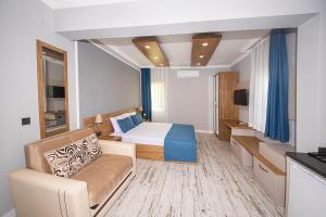 A television and/or entertainment centre at Marina Hotel Bodrum