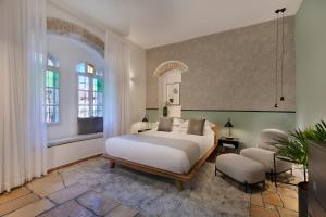 Voodi või voodid majutusasutuse Villa Albi - Machne Yehuda Hotel toas
