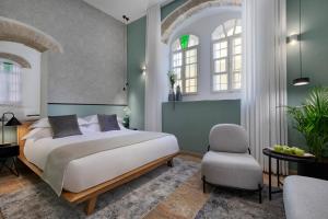 Voodi või voodid majutusasutuse Villa Albi - Machne Yehuda Hotel toas