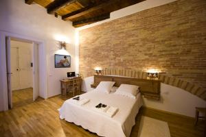 מיטה או מיטות בחדר ב-Castelletto Suites
