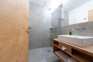 Koupelna v ubytování Alpines Gourmet Hotel Montanara