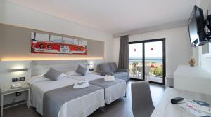 Postel nebo postele na pokoji v ubytování Medplaya Hotel Bali