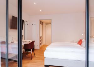 Postel nebo postele na pokoji v ubytování HAIMHAUSERS Hotel Garni