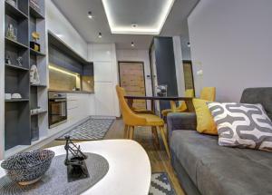 a living room with a couch and a table at Apartment A17 LUX in Jahorina