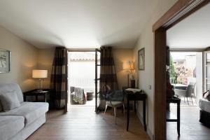 a living room with a couch and a table at Le Pinarello in Sainte-Lucie de Porto-Vecchio