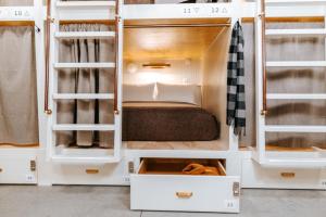 a room with bunk beds with a bed in it at Cache House in Jackson