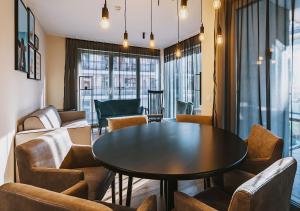 a dining room with a table and chairs at The House Zell am See in Zell am See