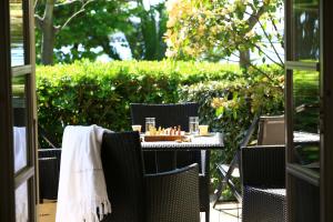 an outdoor table with a tray of candles on it at Le Pinarello in Sainte-Lucie de Porto-Vecchio