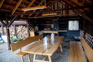 a wooden table in the middle of a room at BURDANÓWKA CAMINO in Krasnystaw