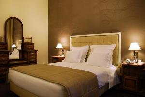 Postel nebo postele na pokoji v ubytování Curia Palace Hotel & Spa