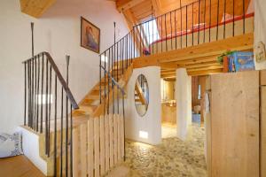 a staircase in a house with wooden ceilings at Hagerhof in Eggstätt