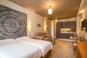 a bedroom with a large bed and a large window at Apartamentos SEVILLA ESTE in Seville