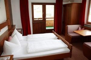 Ένα ή περισσότερα κρεβάτια σε δωμάτιο στο Appartements Strobl