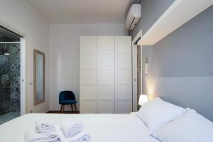 Кровать или кровати в номере PrimoPiano - Piero della Francesca