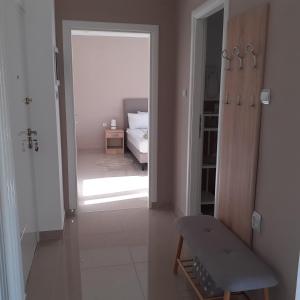 Postel nebo postele na pokoji v ubytování Apartman 4L