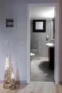 a bathroom with a shower and a toilet and a christmas tree at ''SteliosDimitra'' Guest House II in Nafplio in Nafplio