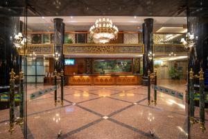 a lobby of a building with a chandelier at Century Pines Resort Cameron Highlands in Cameron Highlands