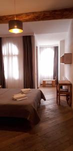 Un pat sau paturi într-o cameră la Bapsha Guesthouse
