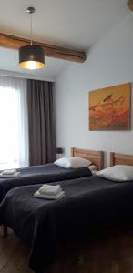 Un pat sau paturi într-o cameră la Bapsha Guesthouse