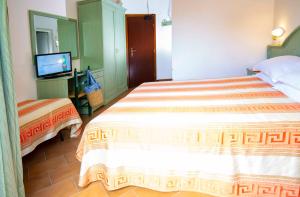 Postel nebo postele na pokoji v ubytování Hotel Villa Sole Resort