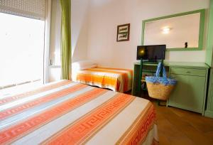 Postel nebo postele na pokoji v ubytování Hotel Villa Sole Resort