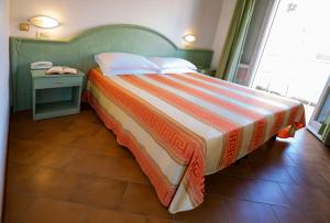 Postel nebo postele na pokoji v ubytování Hotel Villa Sole Resort